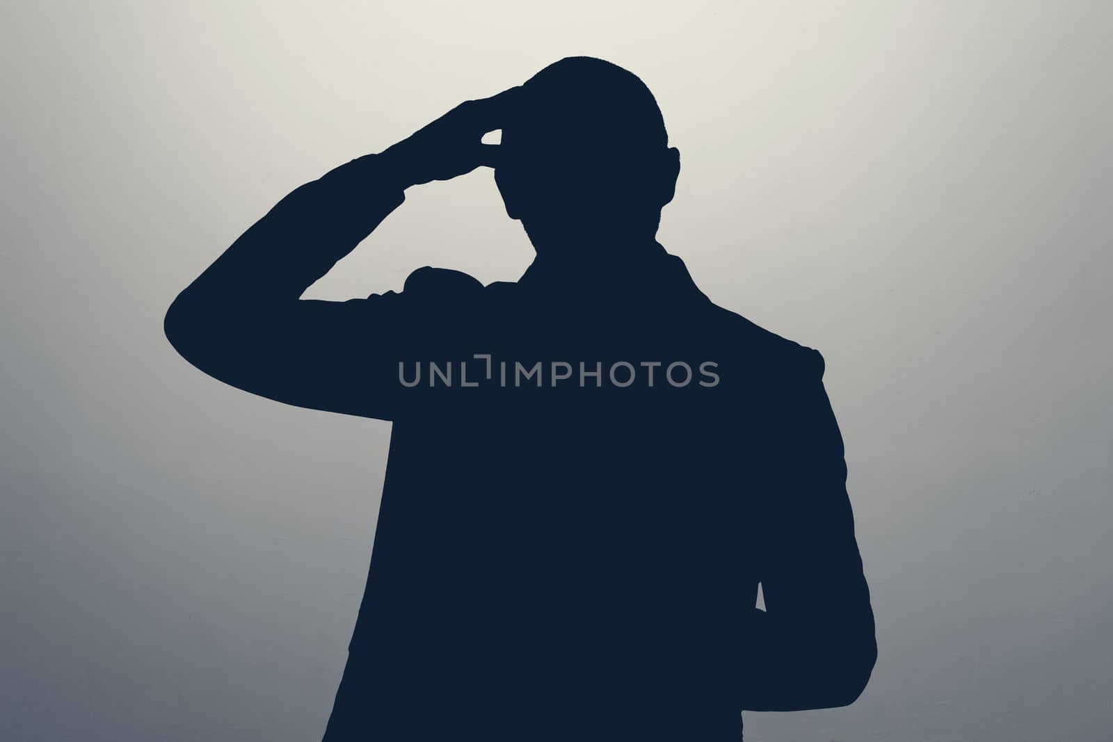 silhouette of man pointing to head with one finger, great idea or thought, good memory