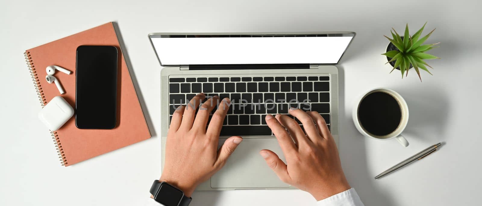 Overhead view of businessman hand working and typing on laptop keyboard. Business, technology and communication concept.