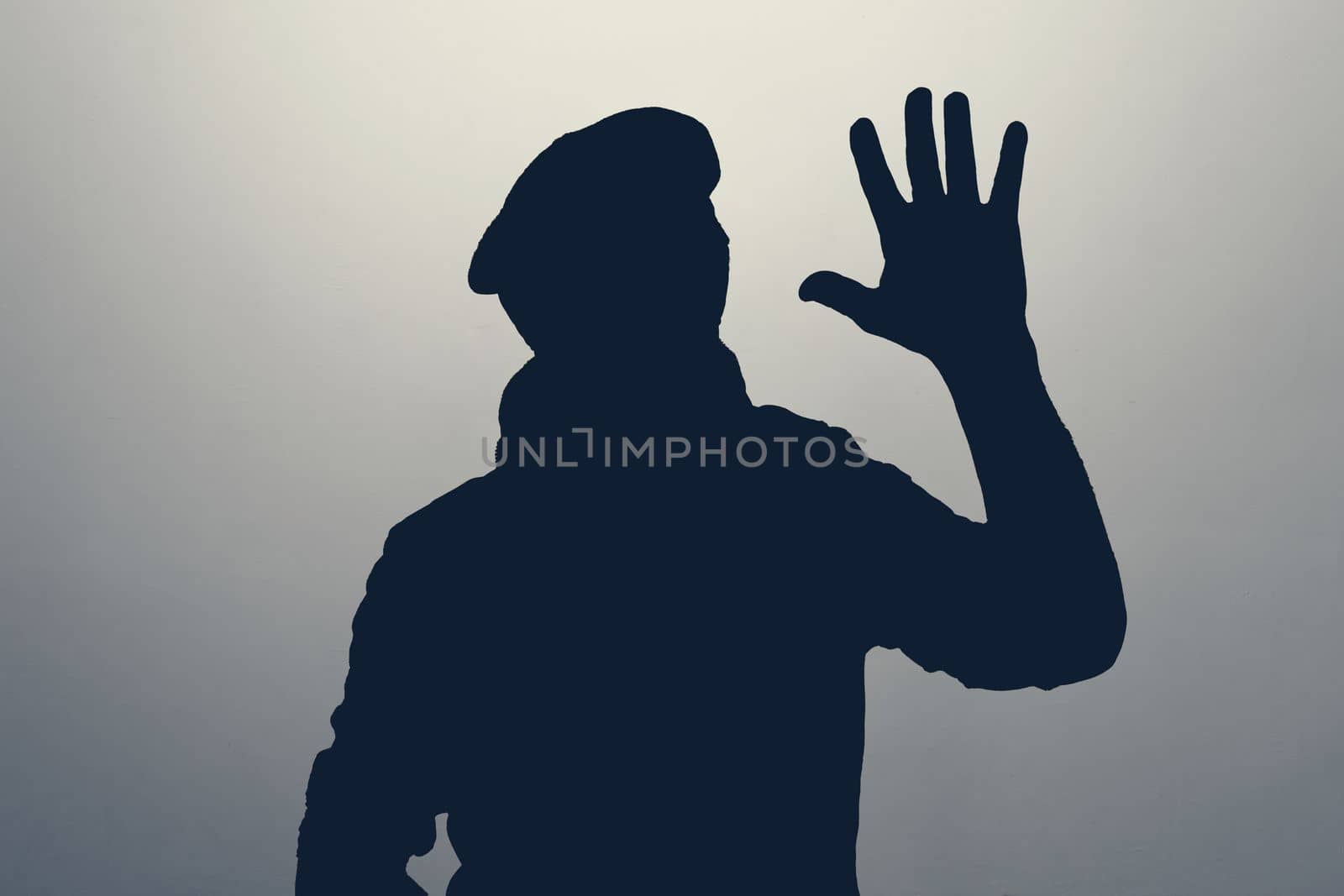 Silhouette of man waving hand in hello gesture. Anonym club concept. You are welcome.