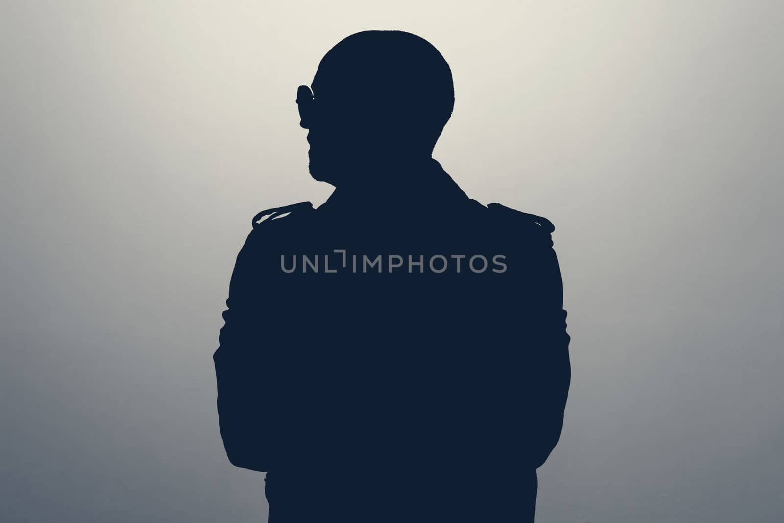 Unknown male person looking aside silhouette in studio. Concept of anonymous or hidden secret.