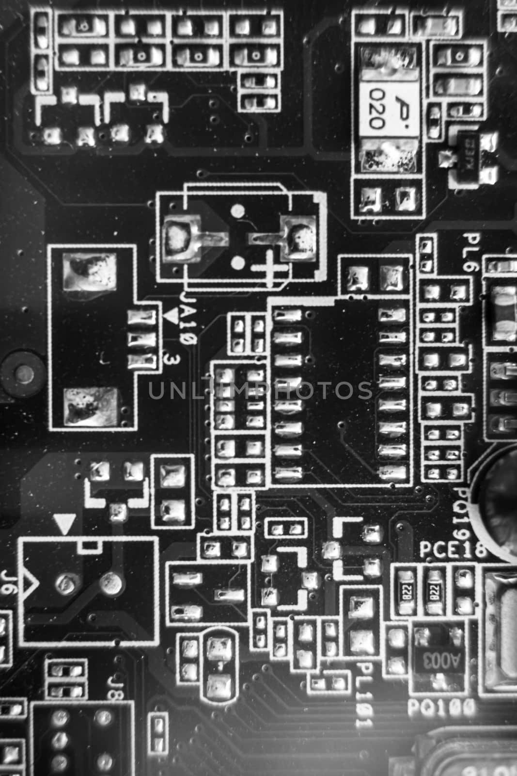 black and white . resistors on the printed circuit board. The concept of electro and microprocessor technologies. Selective focus Printed-Circuit Board Macro Background. pcb. Vertical photo