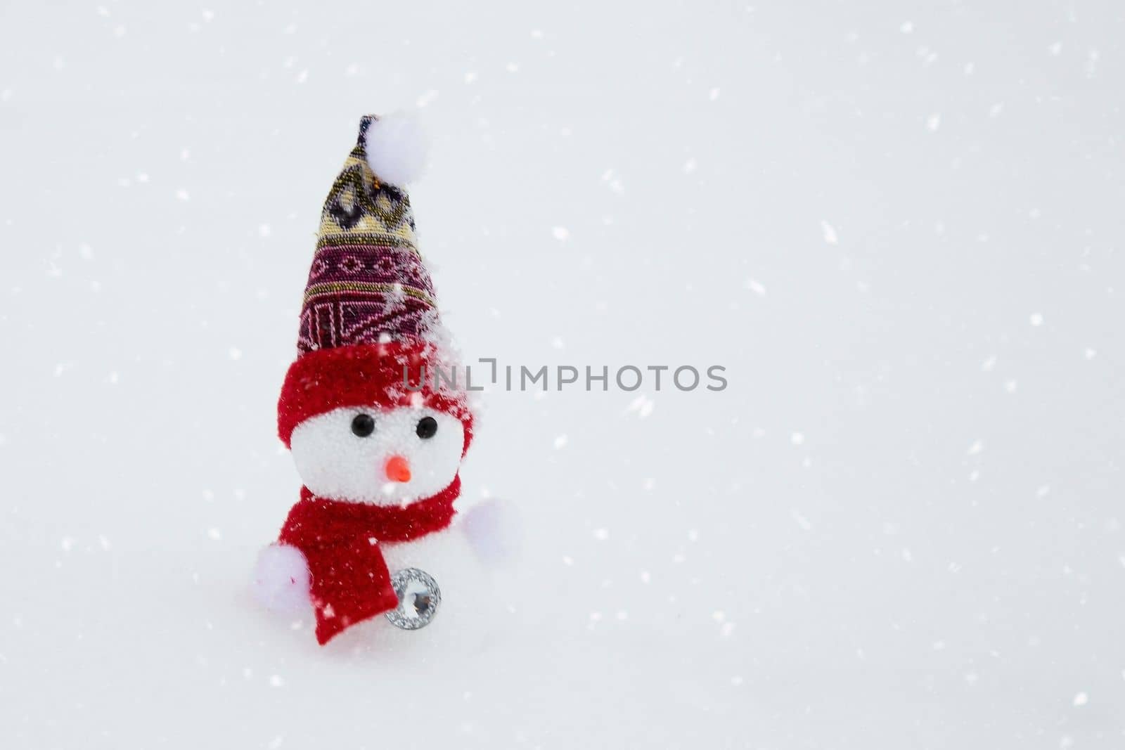 Christmas tree toy snowman on a winter background. Copy space.