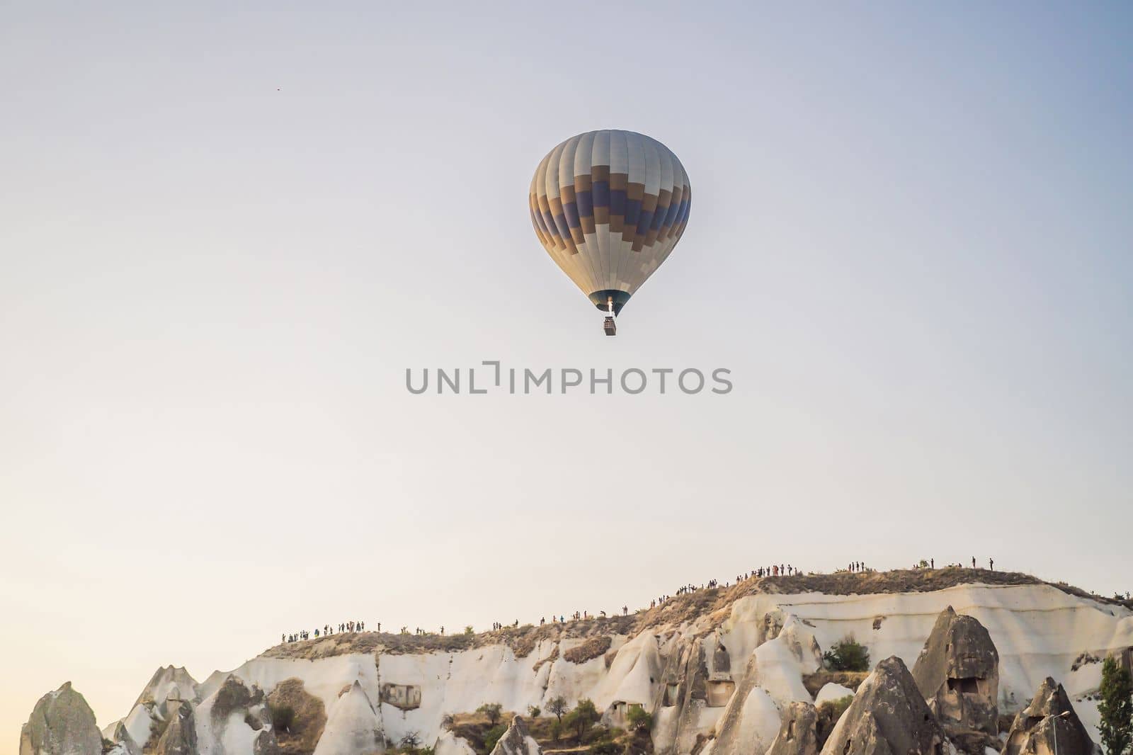 Colorful hot air balloon flying over Cappadocia, Turkey by galitskaya