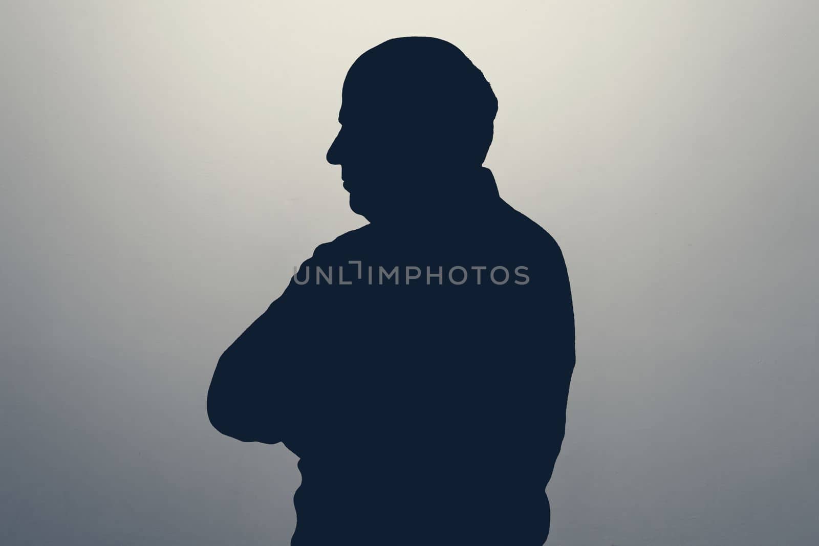 One caucasian senior business man silhouette looking aside