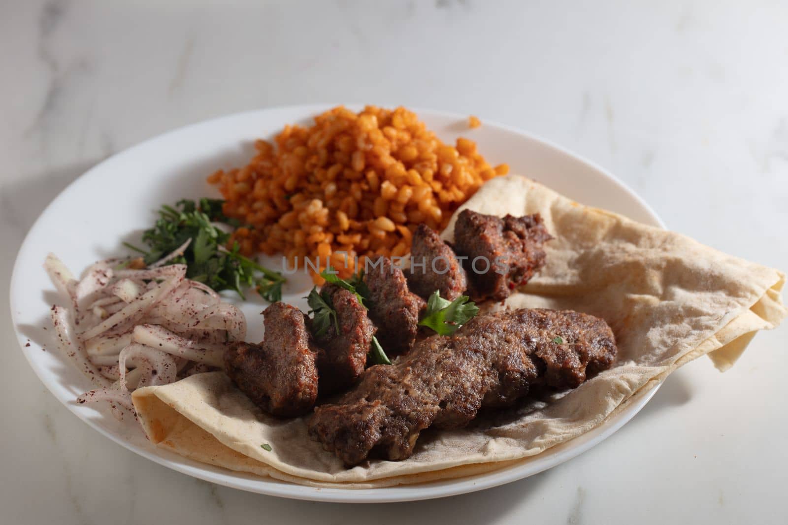 Turkish Adana Kebab with Vegetables on the Plate