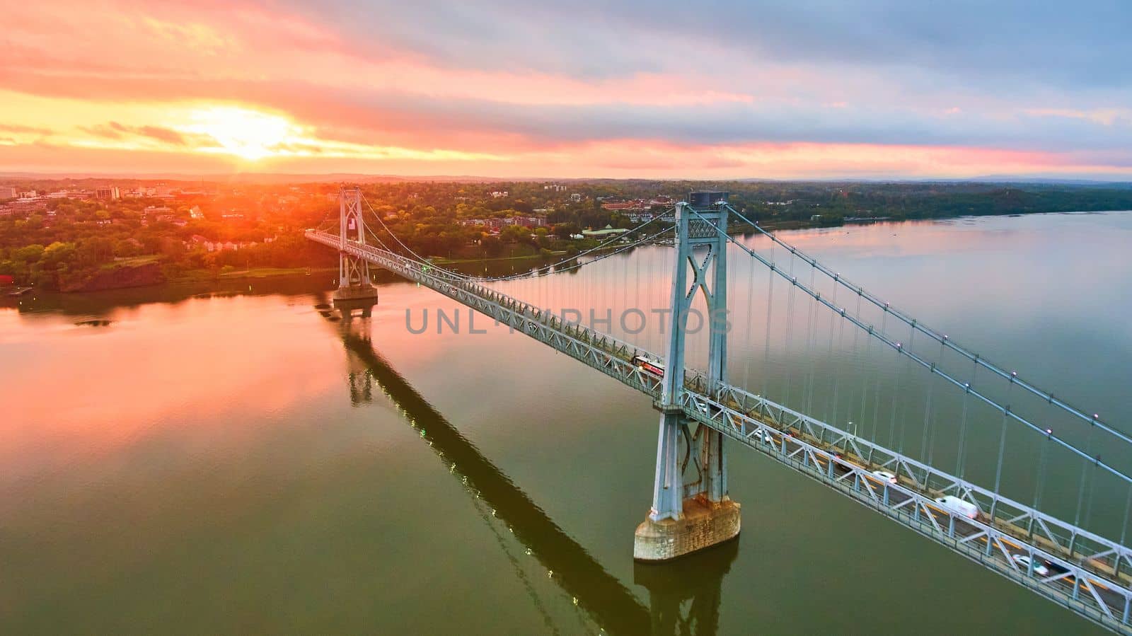 Image of Hudson River bridge aerial with stunning pink and gold sunrise light