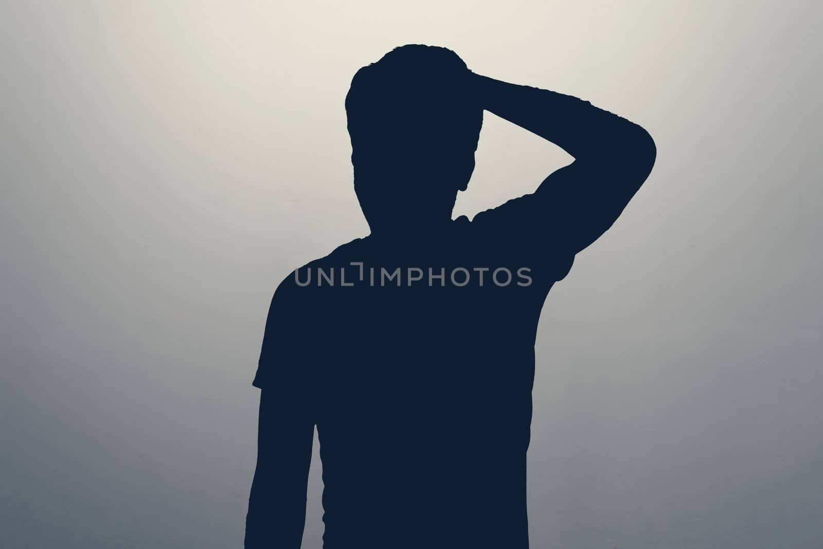 silhouette of man pointing to head with one finger, great idea or thought, good memory