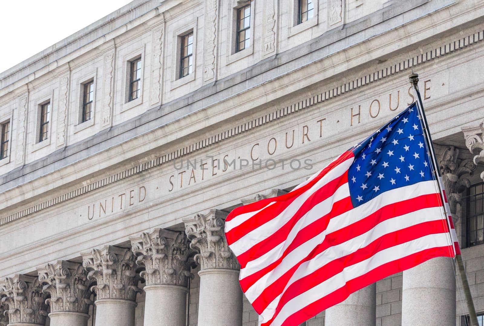 USA national flag waving in the wind in front of United States Court House in New York by Mariakray