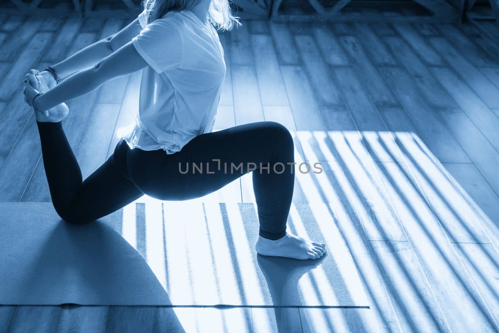 Portrait of a beautiful young woman in yoga pose by Mariakray