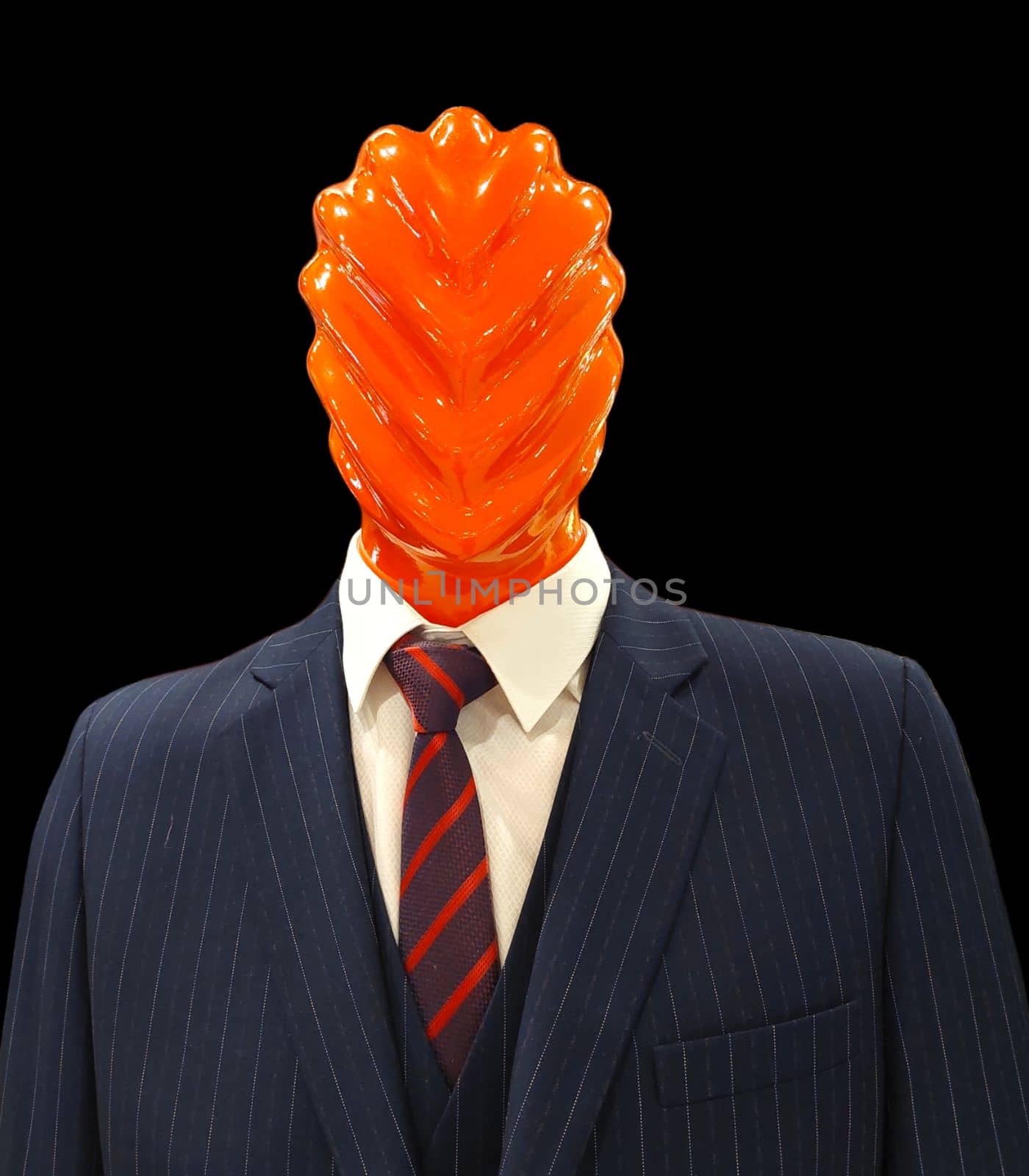 Fashion mannequin wearing a suit with a red abstract head. Isolated background.