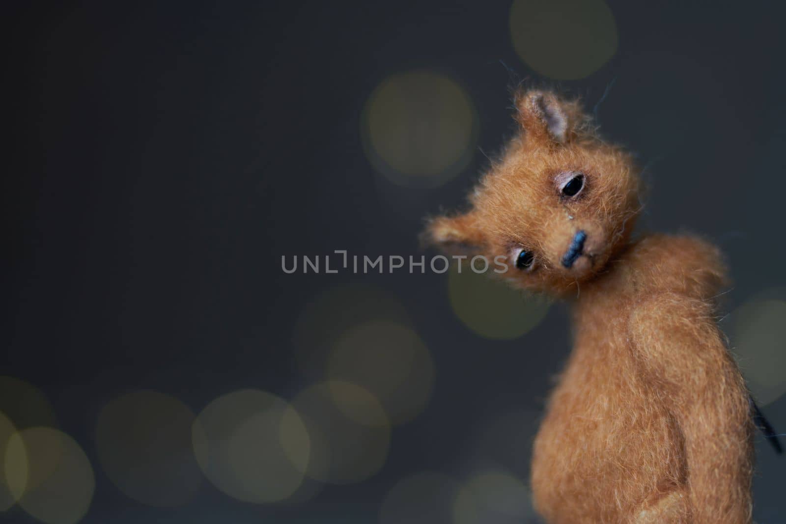 Cute teddy bear isolated on light background. Holiday glowing backdrop. Defocused background with blinking light. Blurred Bokeh. copy space. by Costin