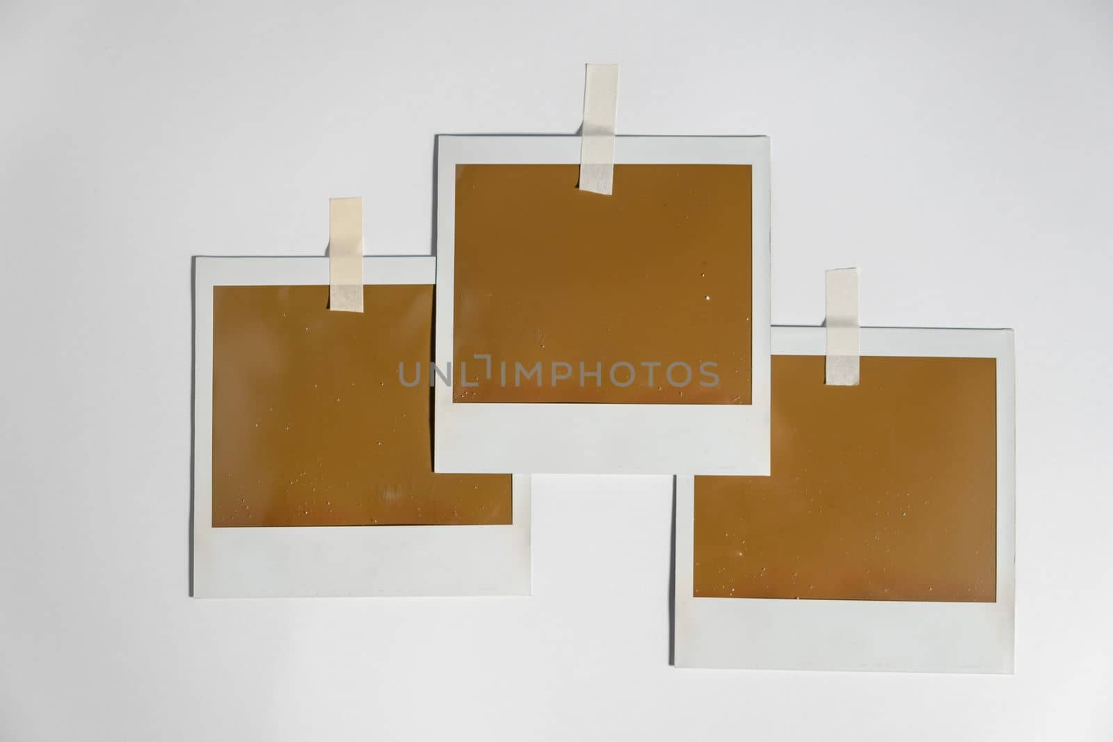 Three blank photo frames on white background.