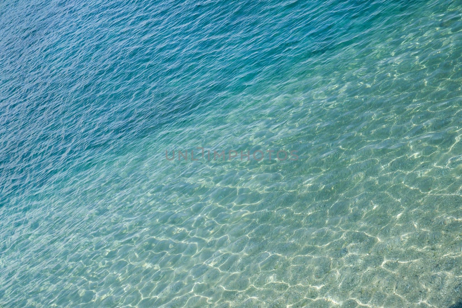 Marine water surface, sun's rays shimmer on water surface by Laguna781