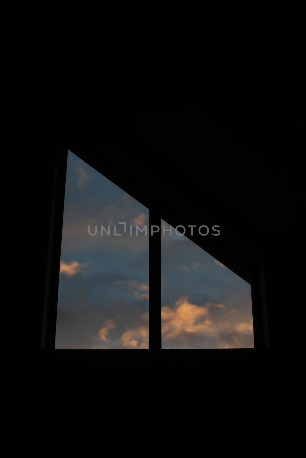 The view from the window of the dramatic sunset sky with clouds. by paralisart