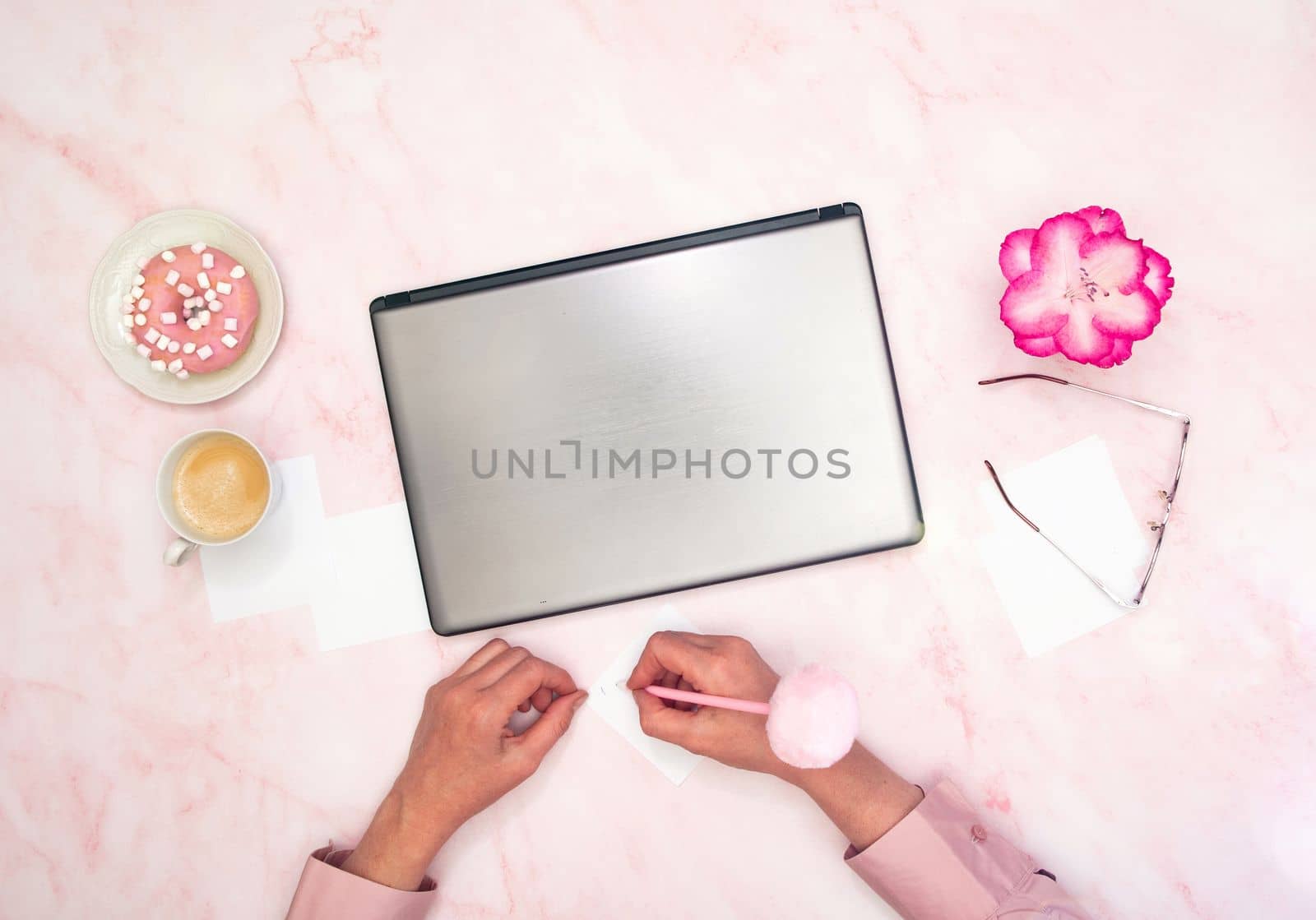 office worker in a pink shirt sits at a laptop, top view,next to a cup of coffee by KaterinaDalemans