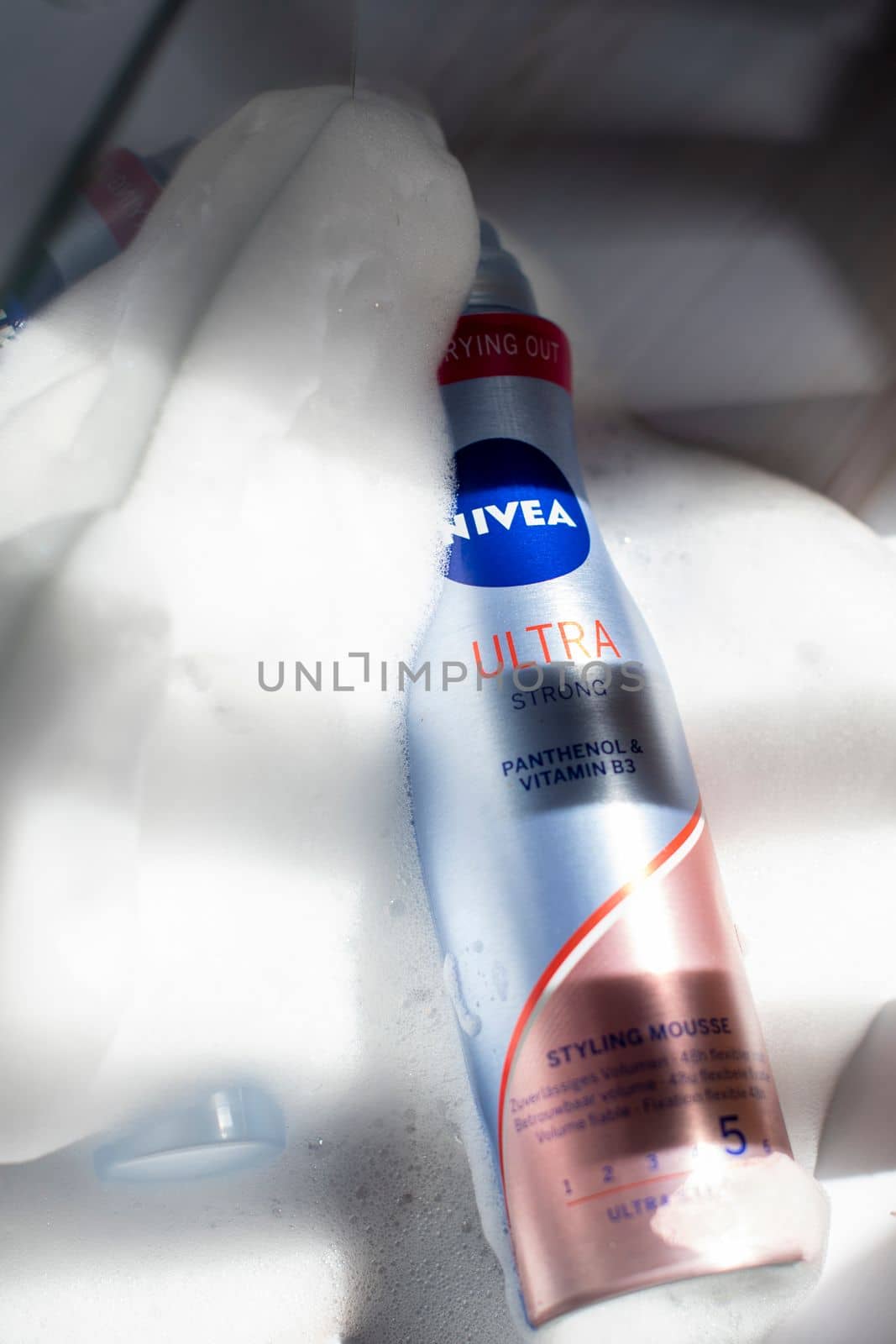 Nivea hair fixing ultra stong styling mousse in foam and sunshine, close-up photo of the product, As,Belgium, Juny 30, 2022, High quality photo,
