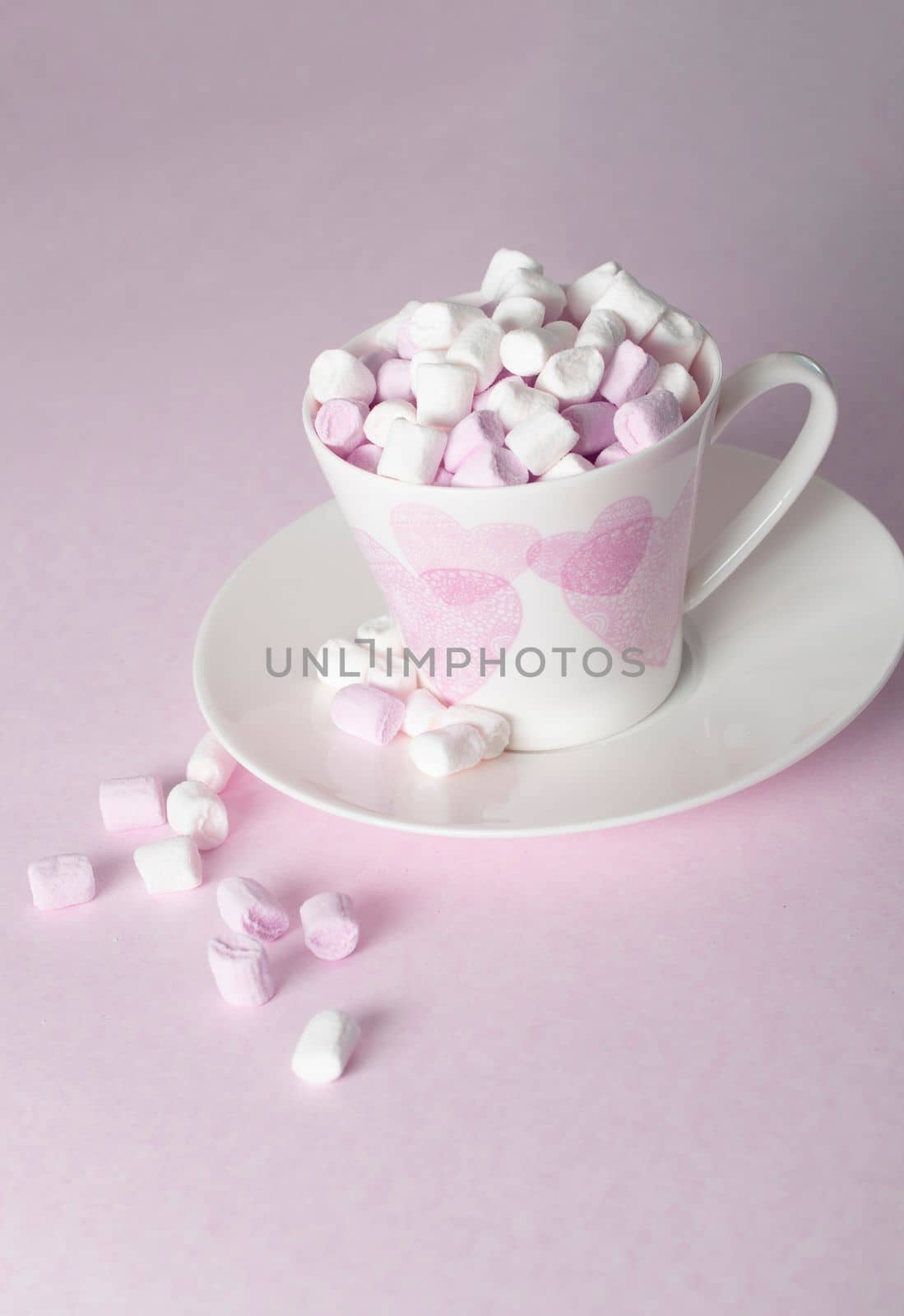 light pink and white marshmallows in a beautiful ceramic cups with pink hearts, Concept Mother's Day gift, Valentine's Day. High quality photo