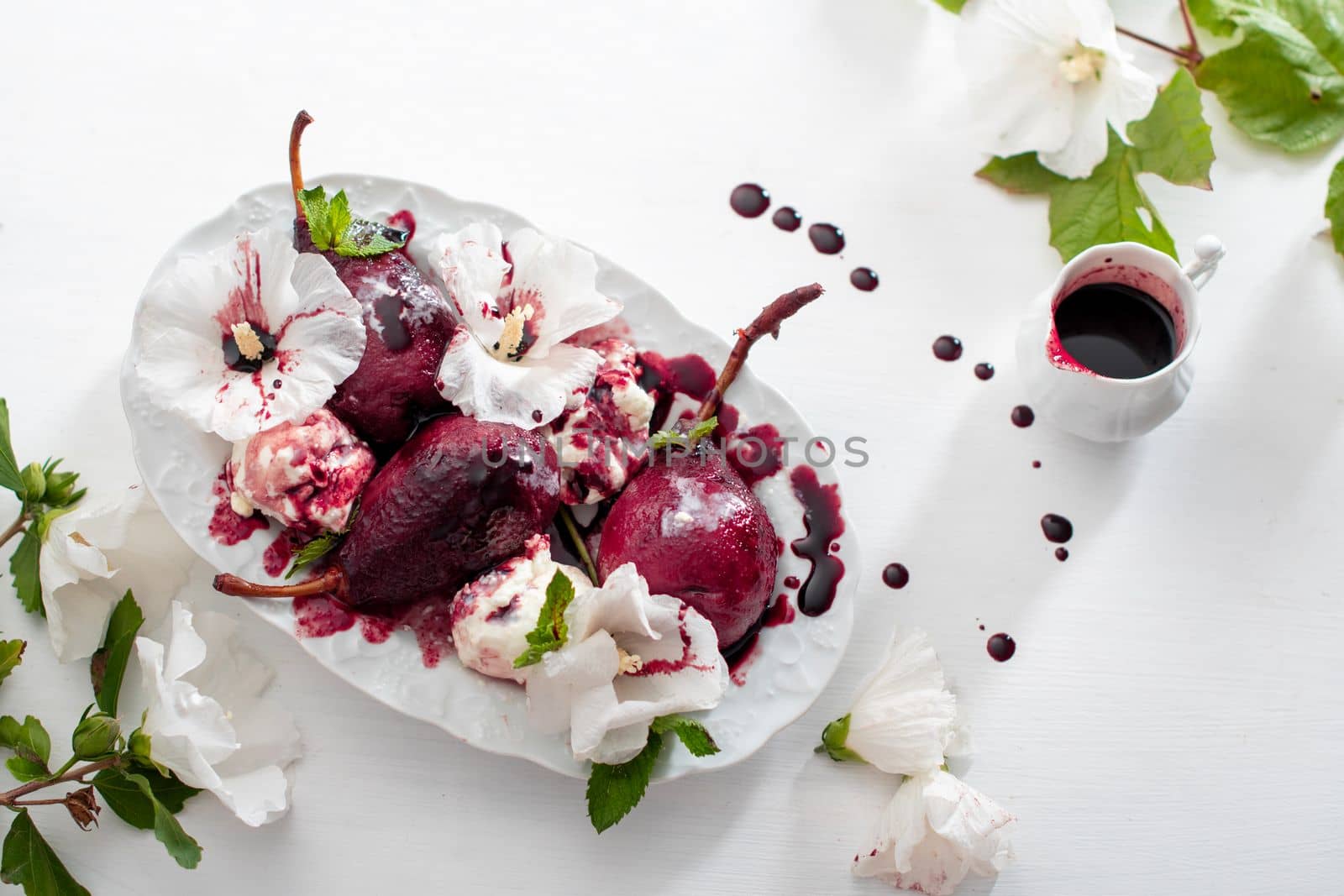 spicy pears cooked in red wine with vanilla ice cream on white dishes background, delicious summer still life and seasonal delicacies, gourmet sweet dessert, magenta color, High quality photo