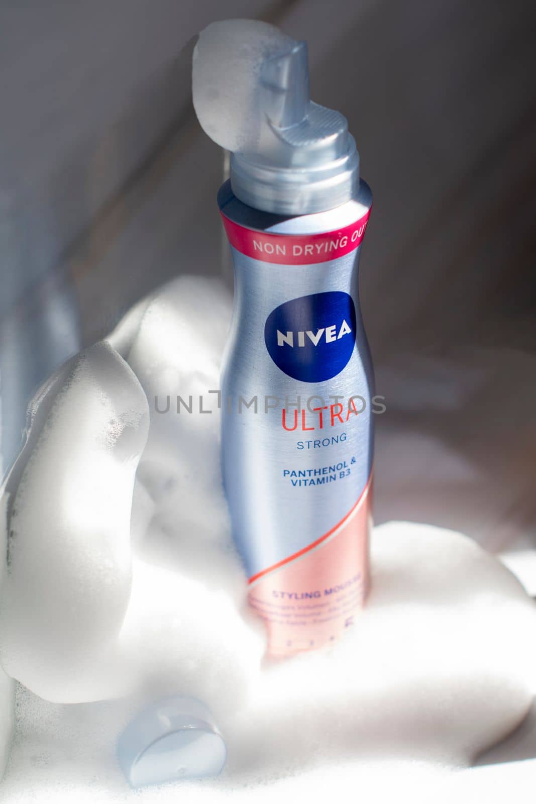 Nivea hair fixing ultra stong styling mousse in foam and sunshine, close-up photo of the product, As,Belgium, Juny 30, 2022, High quality photo,