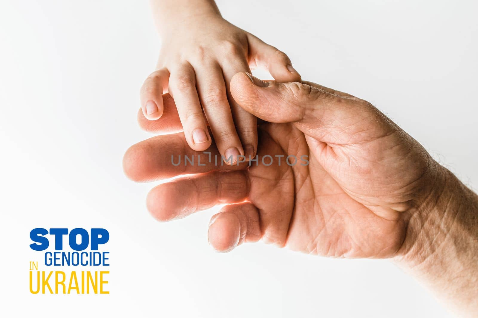 male hand hold children on white background with words stop genocide in ukraine. concept needs help and support, truth will win