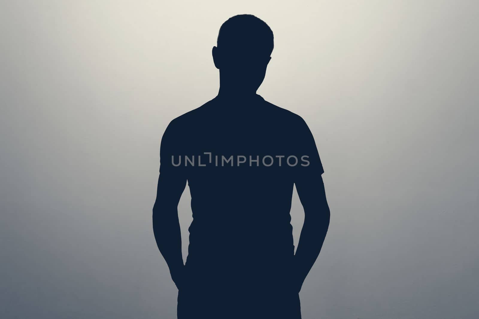 Unknown male person silhouette in studio. Concept of anonymous or hidden secret.