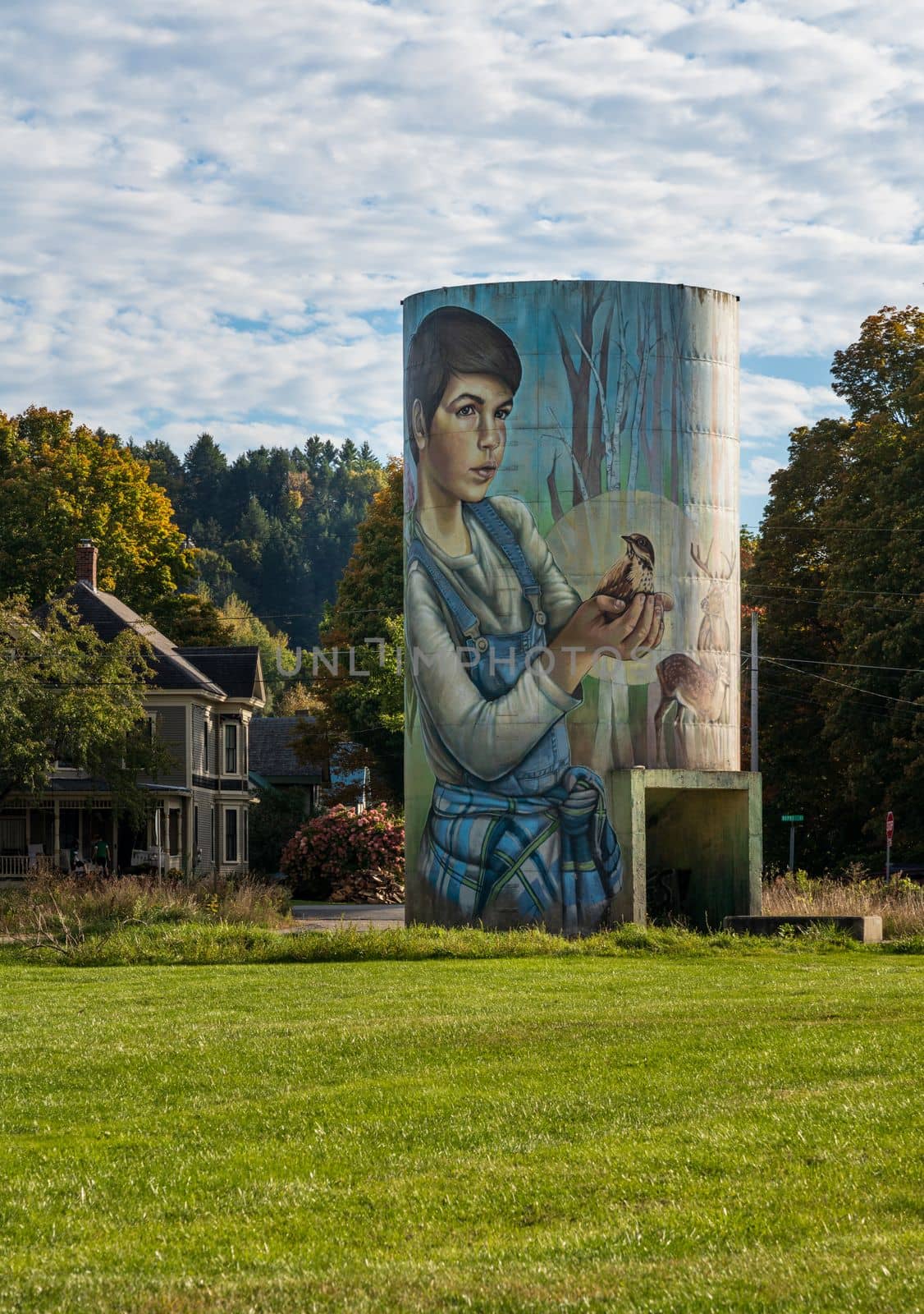 Jefferson, VT - 1 October 2022: Mural by Sarah Rutherford on concrete silo representing the seasons
