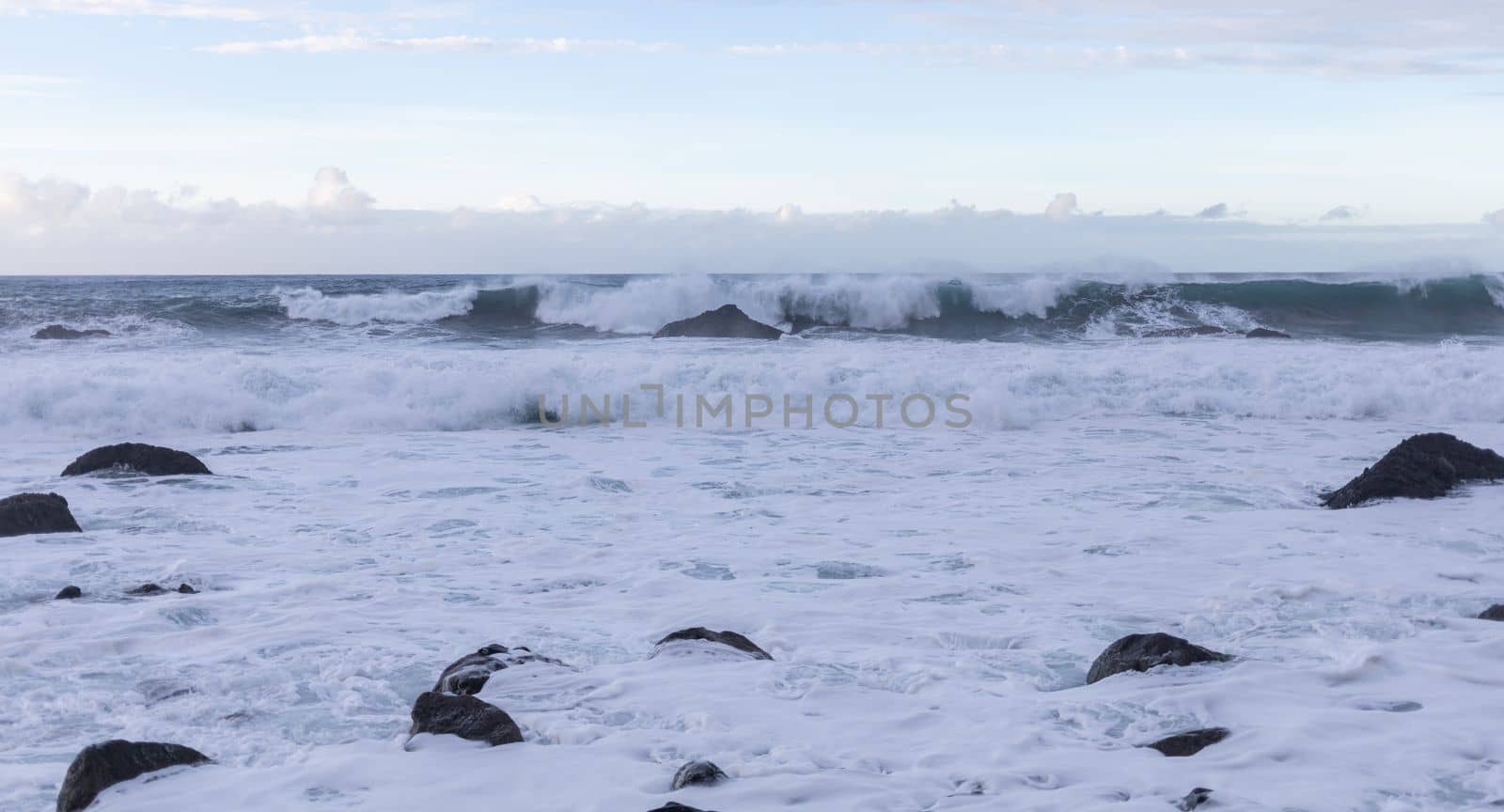 stormy ocean big breaking waves a lot of foam. High quality photo