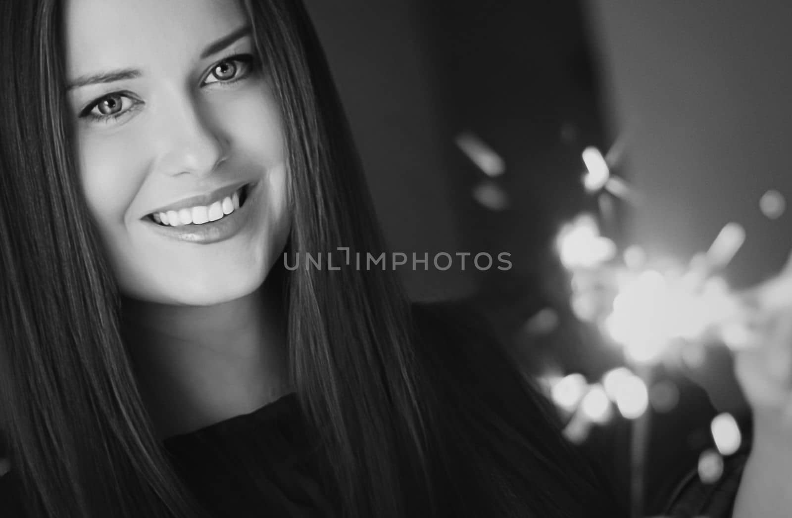 Holiday magic, Christmas and New Year celebration, happy woman with sparklers, portrait