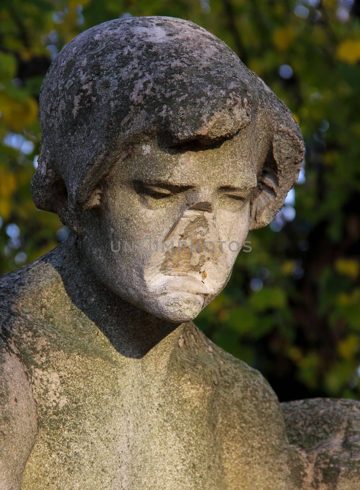 portrait of an eroded faceless gray statue. High quality photo