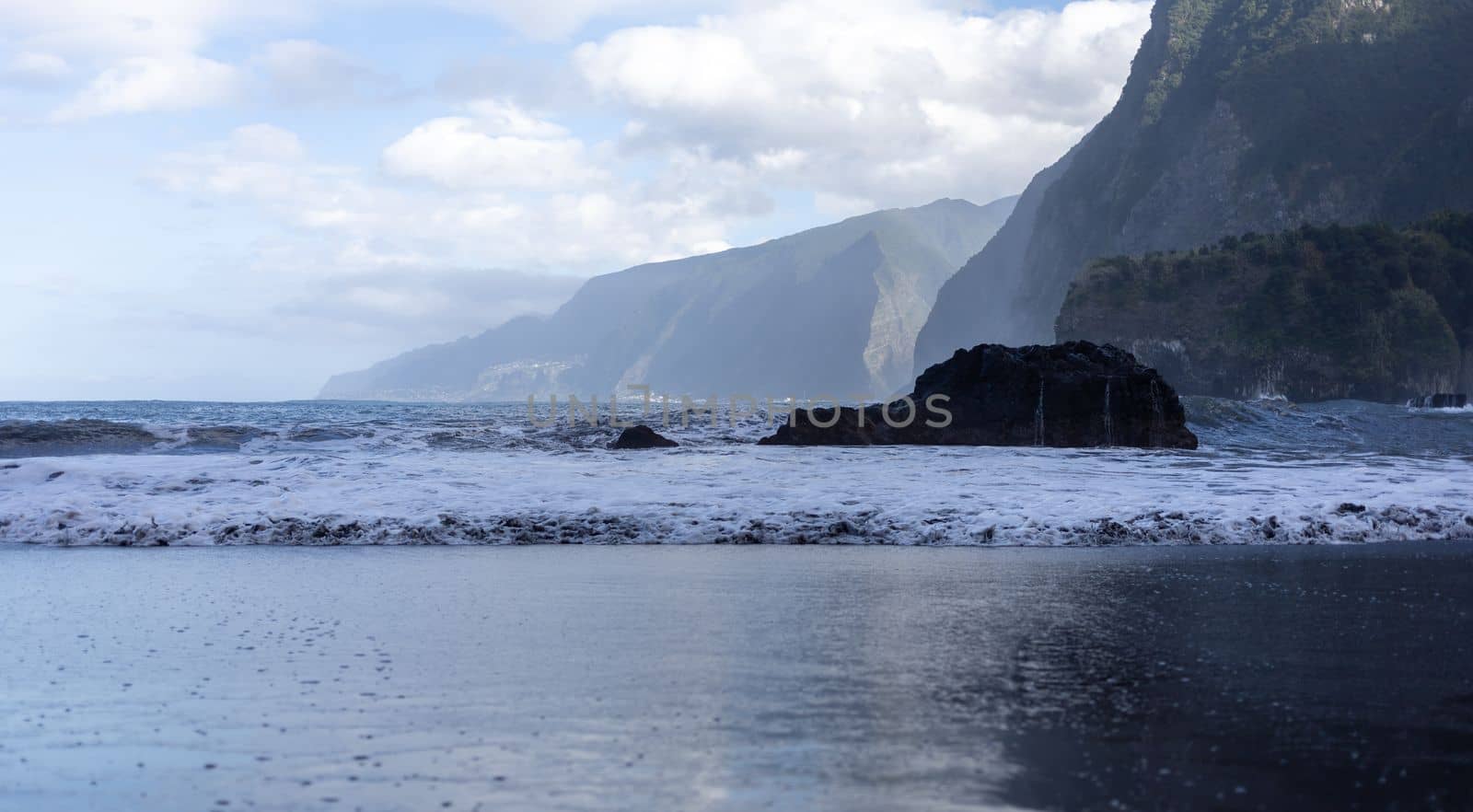 black sand beach of Madeira view on mountains. High quality photo