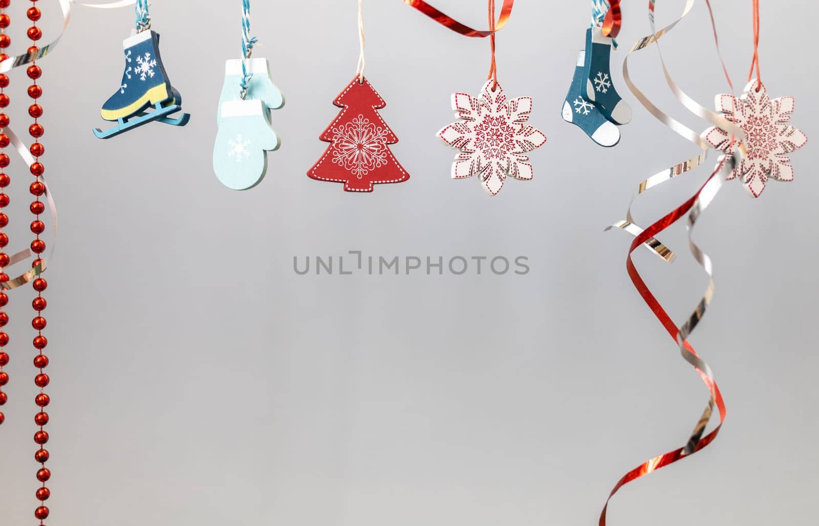 christmas decoration toys hanging over grey background. High quality photo