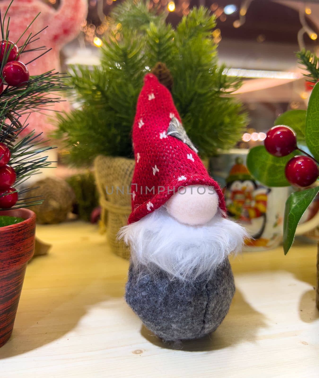 little christmas gnome gonk on decorated background mobile photo. High quality photo