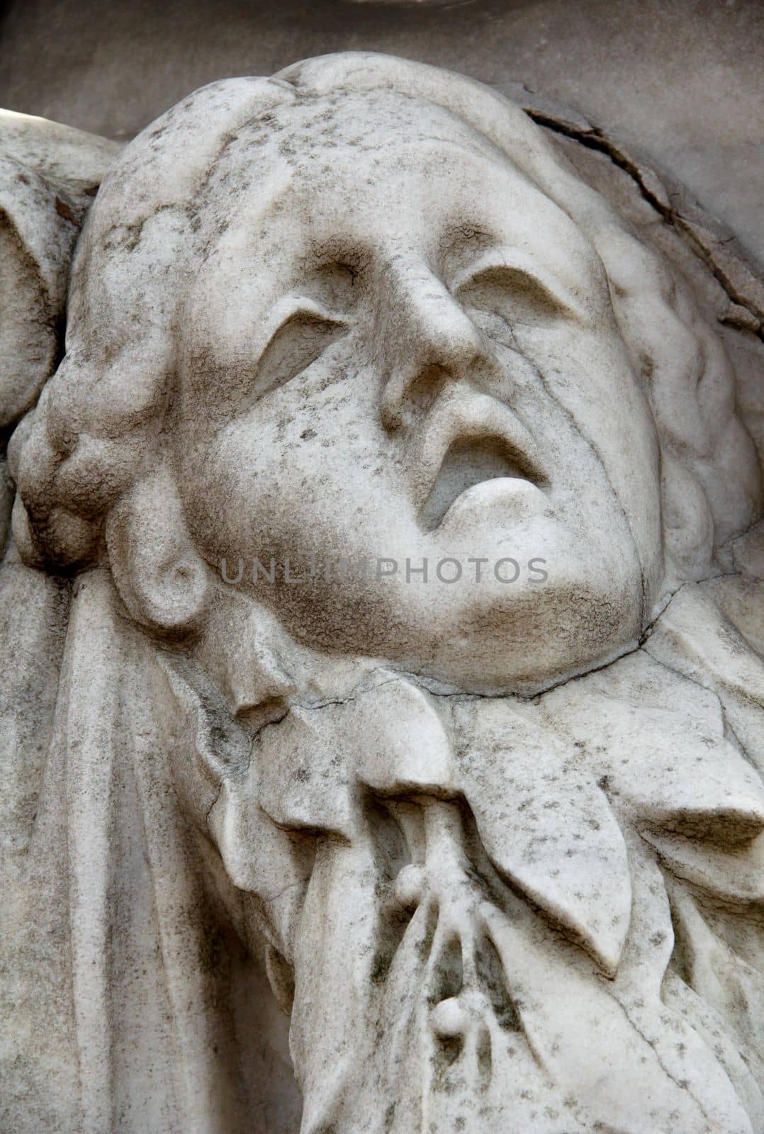Statue of woman on tomb as a symbol of depression pain and sorrow. High quality photo