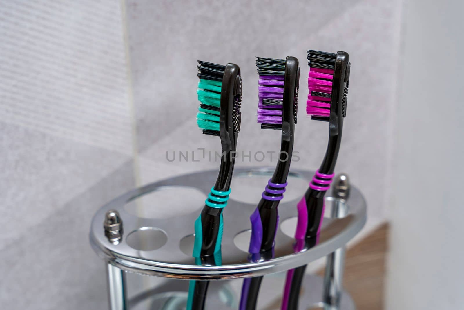 toothbrushes stand in a special stand in the bathroom interior by audiznam2609
