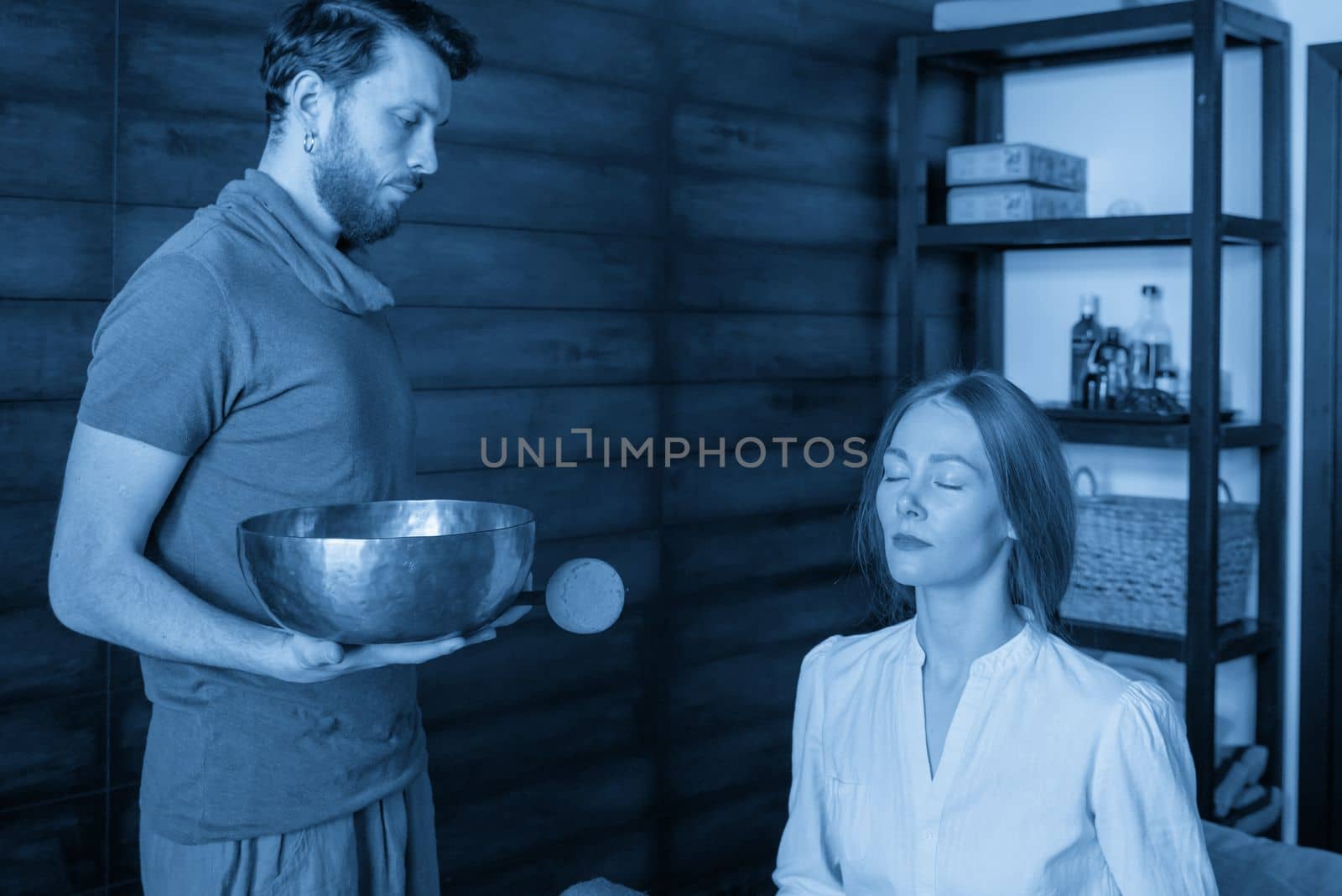 Tibetan singing bowls in sound therapy in spa center by Mariakray