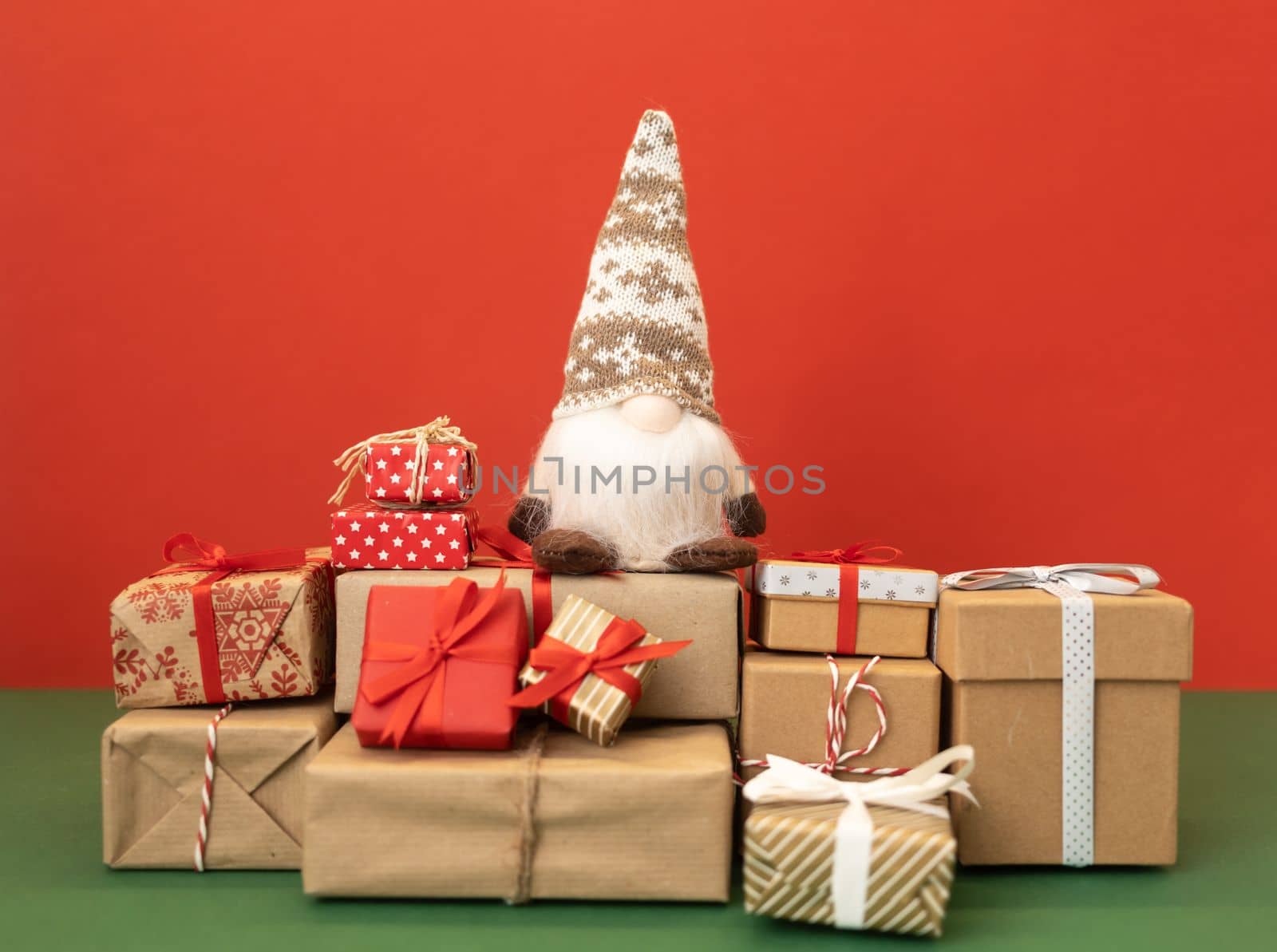 christmas gnome gonk on the craft wrapped gifts. High quality photo