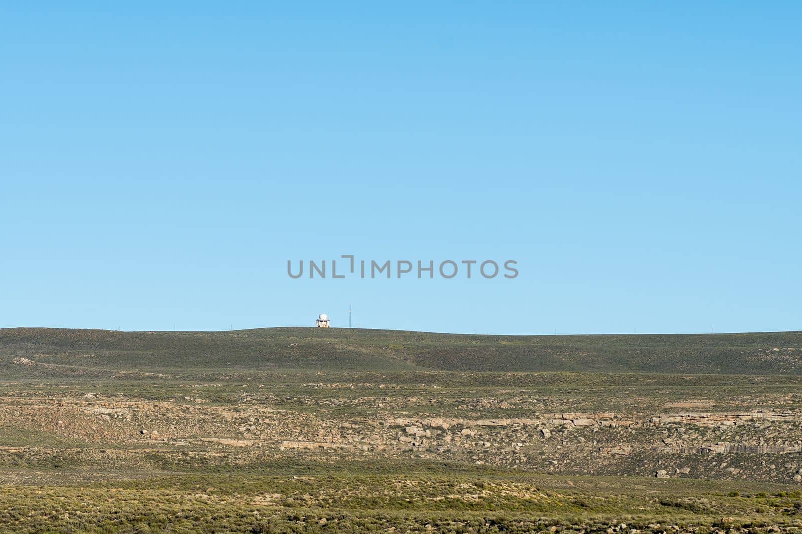 A radar installation is visible on top of Swaarweerberg mountain near Sutherland in the Northern Cape Karoo