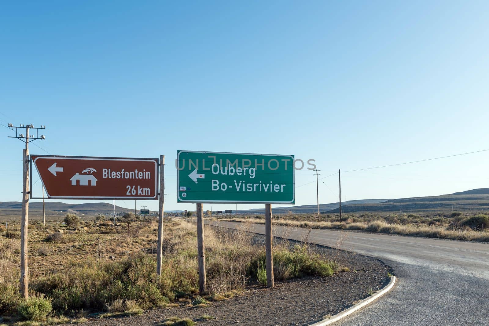 Directional signs at the turn off from road R354 to Ouberg Pass near Sutherland in the Northern Cape Province