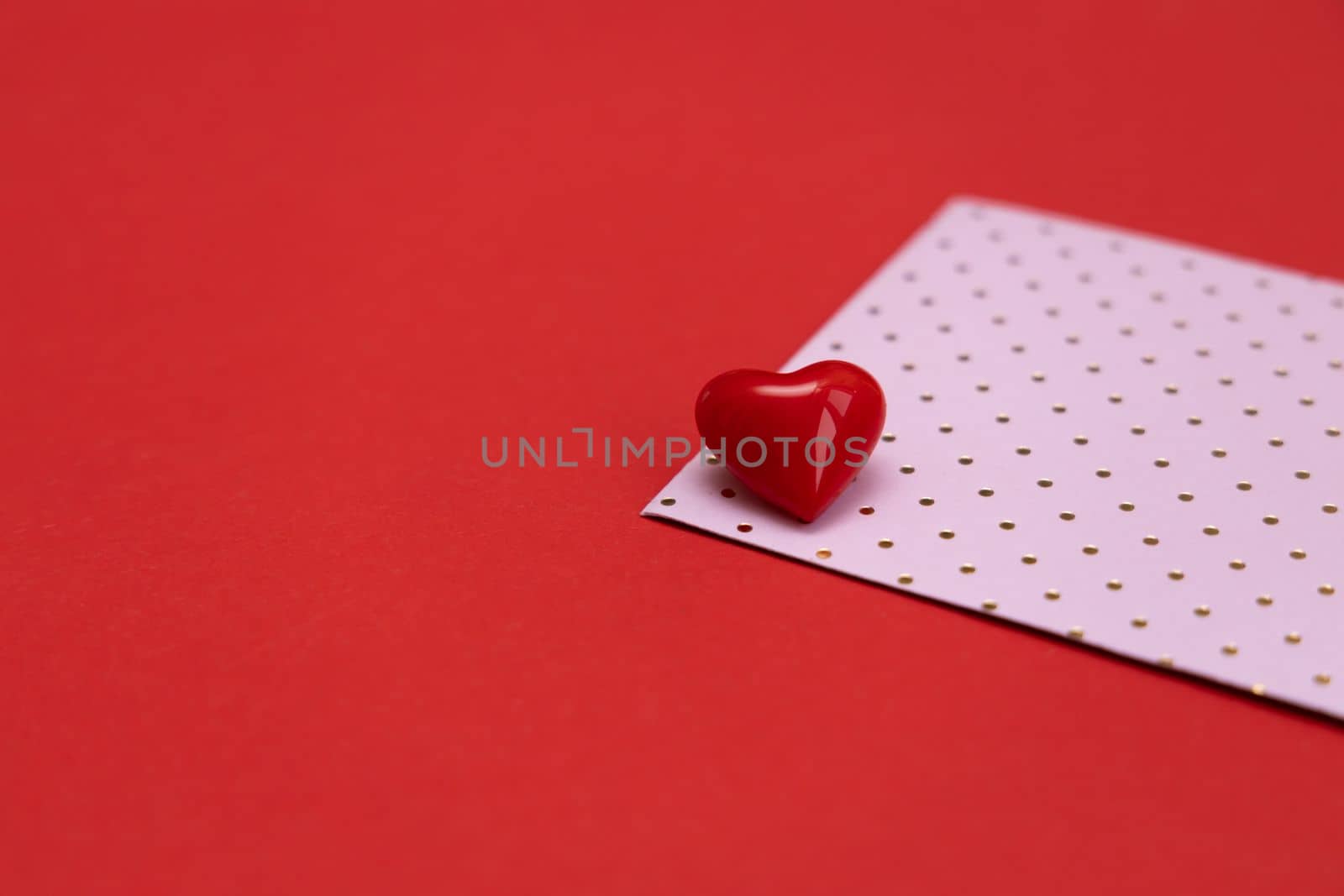 Valentines day red heart on same color background. Monochromatic vivid color. Valentine's day concept. Close up, copy space