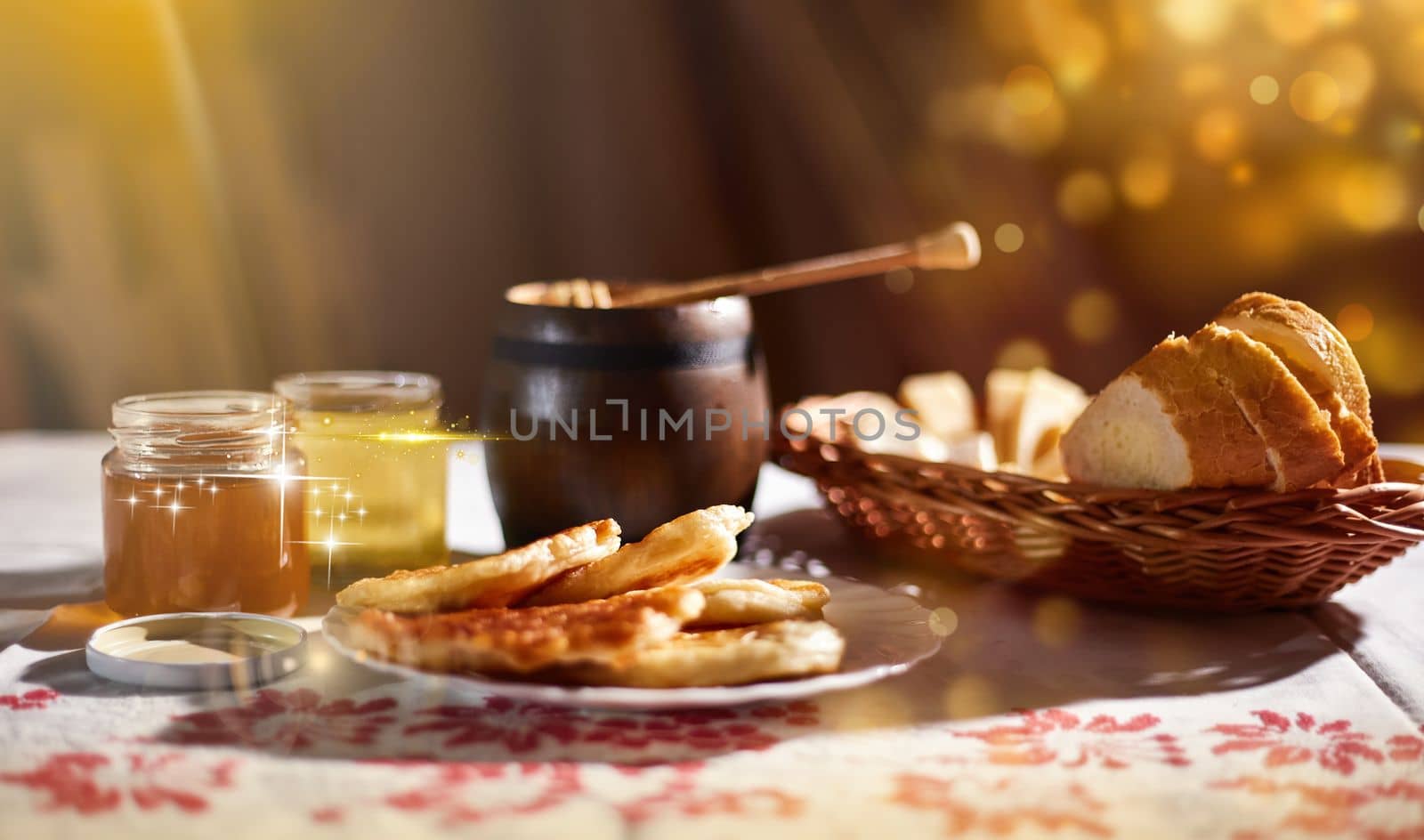 a jar of sweet honey on a table from a garden with apples in a bowl drips from a brush from a spoon a glass jar with cheese and roses and fresh bread with bright light beautiful decoration creative photo in a bucket on a wooden table in a garden with flowers for breakfast delicious food. High quality photo