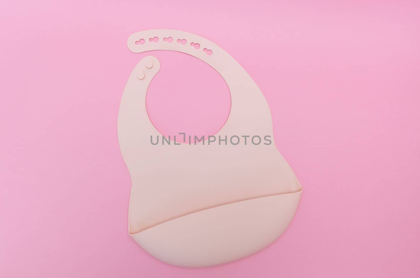Silicone bib. Pastel pink color. Baby lead weaning.