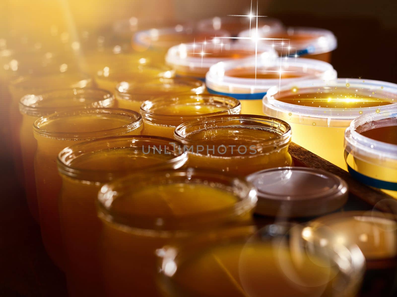 a jar of sweet honey in barrels are stored on a shelf in the pantry sweet food and delicious. High quality photo