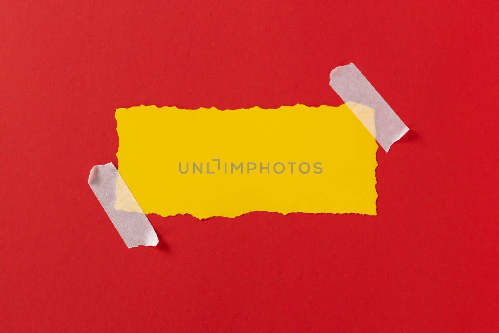 Black friday concept. Top view of yellow torn paper sheet and black friday text on red background. Composition Black Friday. Vivid colors by Ri6ka