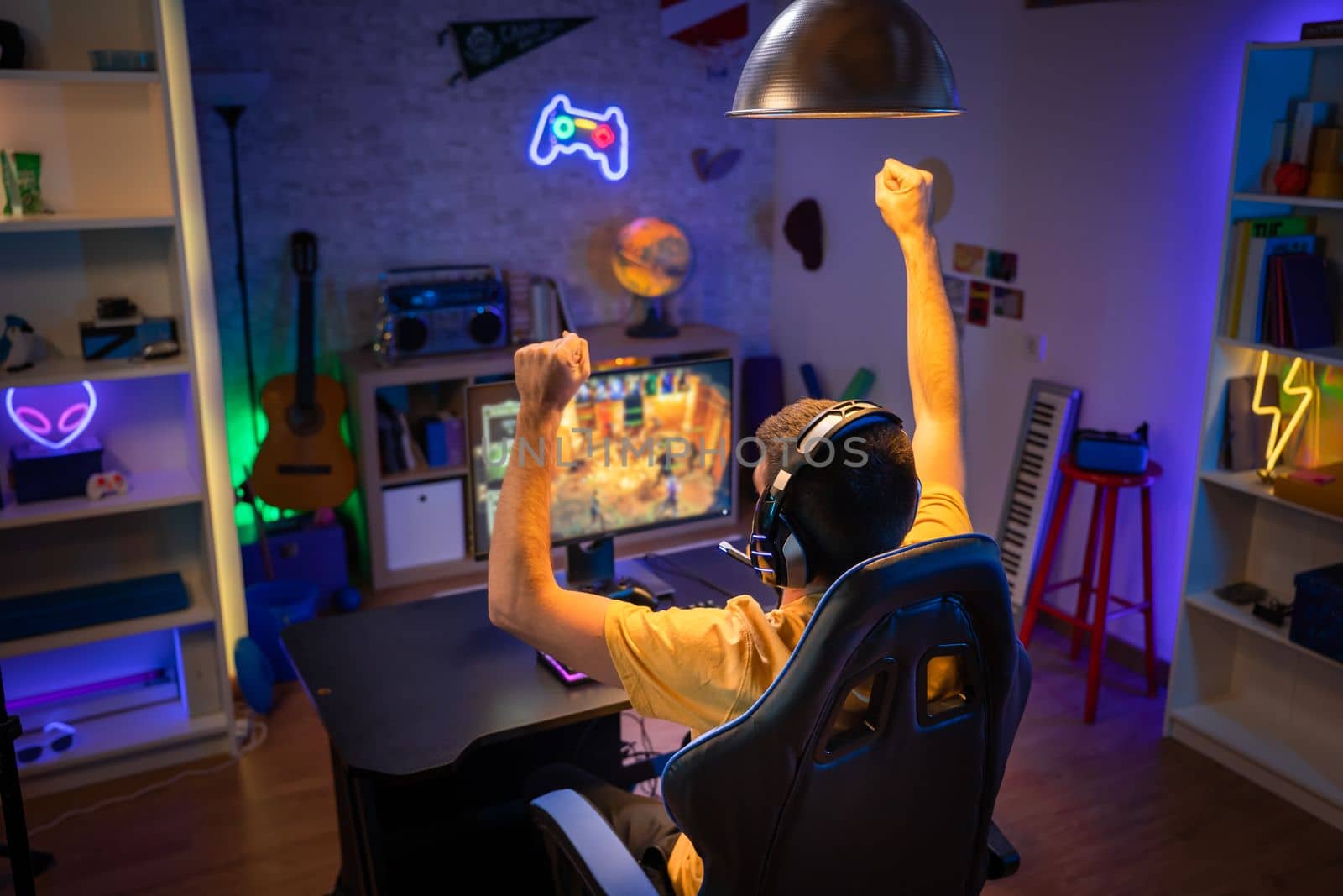 Professional Gamer winning and celebrating victory Online Video Game on Computer by PaulCarr