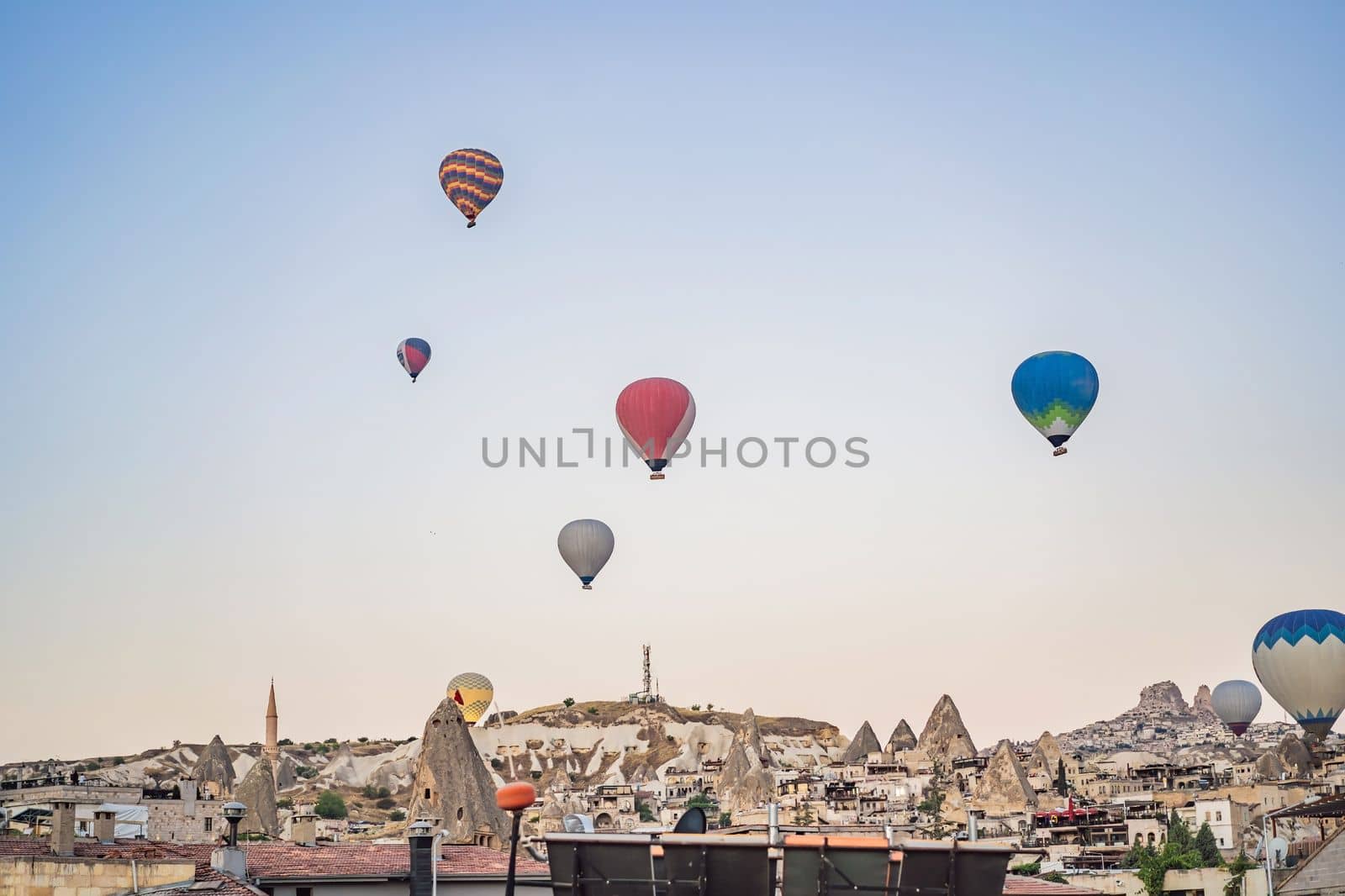 Colorful hot air balloon flying over Cappadocia, Turkey by galitskaya