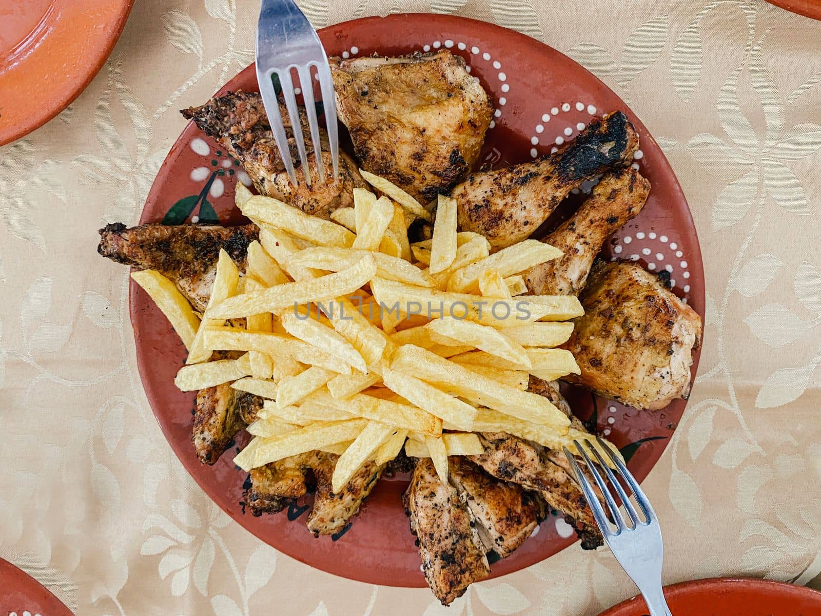 French fries potatoes, grilled tasty chicken. Healthy food and family together concept by papatonic