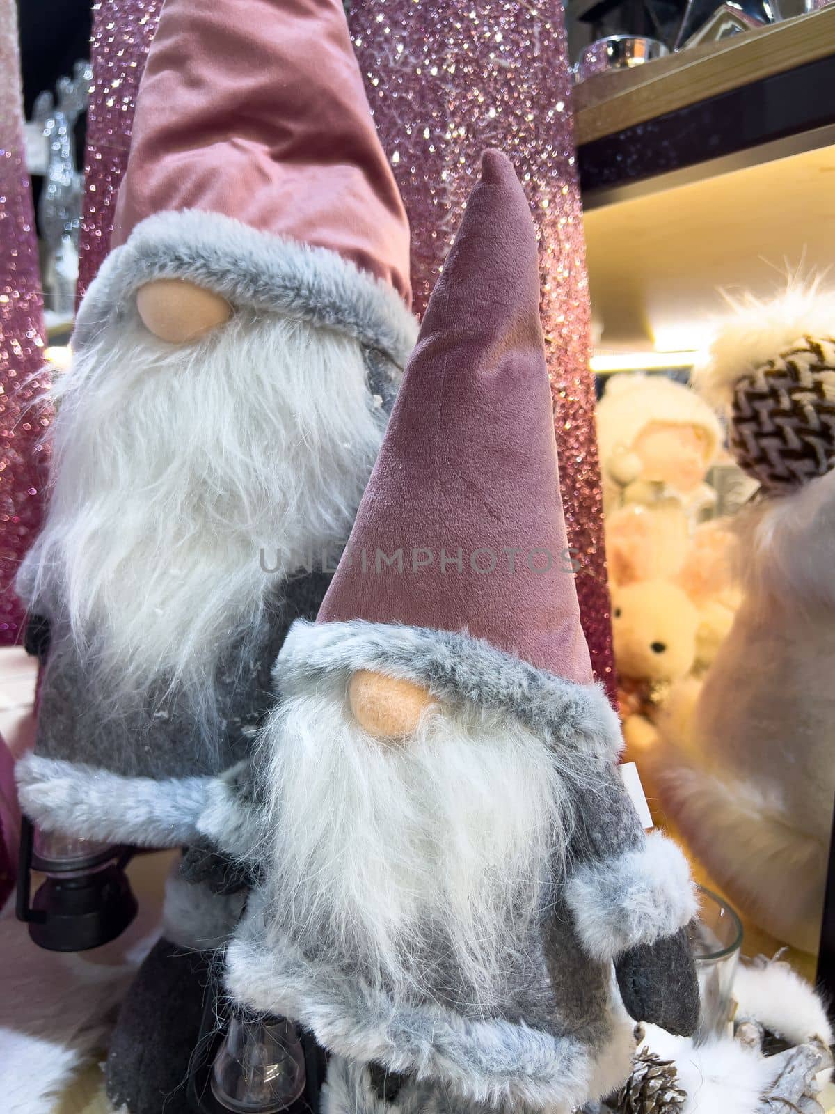 three little christmas gnomes gonks in pink hats mobile photo by Chechotkin