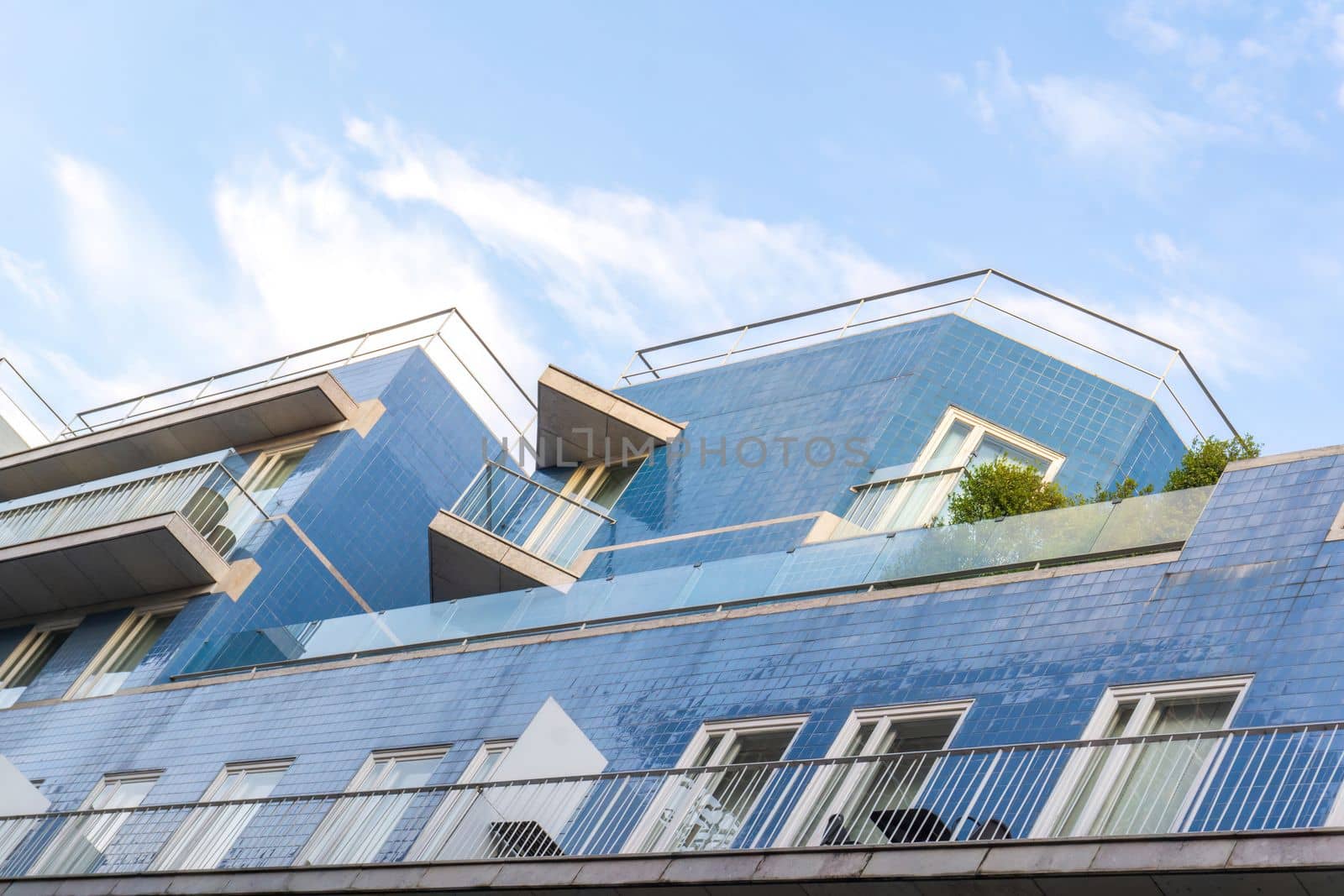 Portuguese house covered with blue tiles against the sky background