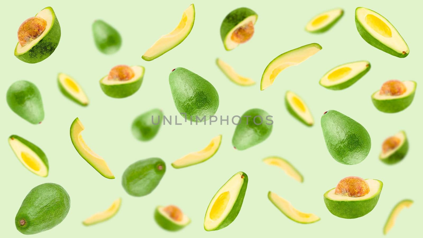 Creative levitation pattern with avocado. Selective focus. Isolated vegetables. Packaging concept. Clip art image for package design.