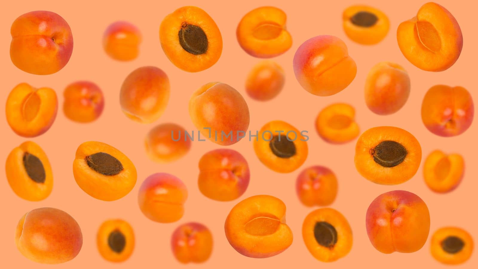 Falling apricot ruits on orange surface for advertisement by Ciorba